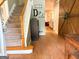 Inviting foyer with hardwood floors, carpeted stairs, and a decorative barn door at 80 Jacksons Vly, Sharpsburg, GA 30277