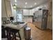 Spacious kitchen with granite countertops, stainless steel appliances, and ample cabinet space at 80 Jacksons Vly, Sharpsburg, GA 30277