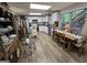 Well-lit kitchen with white cabinets, stainless steel appliances, and dining area at 80 Jacksons Vly, Sharpsburg, GA 30277