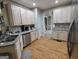 Well-equipped kitchen with granite countertops, stainless appliances, and hardwood floors at 80 Jacksons Vly, Sharpsburg, GA 30277