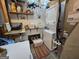 Functional laundry room features stacked washer/dryer, shelves, and ample storage space at 80 Jacksons Vly, Sharpsburg, GA 30277