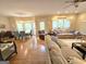Open-concept living room and dining area, showcasing hardwood floors and natural light at 80 Jacksons Vly, Sharpsburg, GA 30277