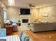 Cozy living room featuring a fireplace, ceiling fan, and comfortable sofas at 80 Jacksons Vly, Sharpsburg, GA 30277