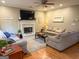 Inviting living room with fireplace, ceiling fan, and comfortable seating arrangement at 80 Jacksons Vly, Sharpsburg, GA 30277