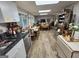 Expansive living space featuring a kitchen, dining area, and cozy seating, ideal for entertaining at 80 Jacksons Vly, Sharpsburg, GA 30277