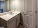 Bathroom vanity features a white countertop, sink, and modern faucet, with a white door at 360 Hayden Cir, Woodstock, GA 30189