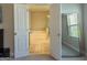 View through the open door of a bright bathroom featuring a soaking tub and shower at 360 Hayden Cir, Woodstock, GA 30189