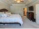 Bright bedroom features a tray ceiling, carpeted floor, TV, and a bed at 360 Hayden Cir, Woodstock, GA 30189
