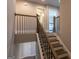 Staircase with decorative wooden handrail and dark iron spindles leading to upper level at 360 Hayden Cir, Woodstock, GA 30189