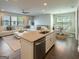 Spacious living area features hardwood floors, a view of the kitchen, and a dining area at 360 Hayden Cir, Woodstock, GA 30189