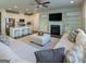 Bright, open-concept living room with fireplace, built-ins, and a view of the modern kitchen at 360 Hayden Cir, Woodstock, GA 30189
