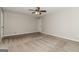 Neutral bedroom with a ceiling fan and a large window at 8091 Bouldercrest Pl, Douglasville, GA 30135