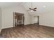 Spacious living room with wood floors, high ceilings, and an open layout to the staircase and dining room at 8091 Bouldercrest Pl, Douglasville, GA 30135