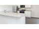 Close-up of kitchen island with stainless steel appliances and granite countertops at 236 Oliver Dr, Locust Grove, GA 30248