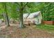 A spacious backyard with a wooden deck and lush greenery provides a private outdoor retreat at 3979 Doral Cir, Atlanta, GA 30360