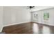 A primary bedroom with hardwood floors and two windows for natural light at 3979 Doral Cir, Atlanta, GA 30360