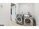 Laundry room featuring a stainless steel washer and dryer at 3979 Doral Cir, Atlanta, GA 30360