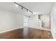 Bright living room featuring hardwood floors, tiled entry, and easy access to kitchen and stairs at 3979 Doral Cir, Atlanta, GA 30360