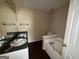 Bathroom with a double sink vanity and tub at 130 Elm St, Hampton, GA 30228