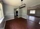Dining room with hardwood floors and view of kitchen at 130 Elm St, Hampton, GA 30228
