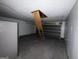 Attached garage featuring an attic access ladder, offering potential for storage or workspace at 130 Elm St, Hampton, GA 30228