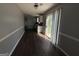 Living room with hardwood floors and view of kitchen at 130 Elm St, Hampton, GA 30228