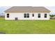 Expansive backyard with lush green lawn and white siding at 255 Oliver Dr, Locust Grove, GA 30248