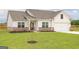 Beautifully landscaped single-Gathering home with a well-manicured lawn at 255 Oliver Dr, Locust Grove, GA 30248