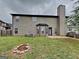 Home exterior with a large backyard, patio, and fire pit area at 305 Mango Ct, Mcdonough, GA 30253
