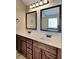 Bathroom featuring double sinks with a mirror, modern fixtures and ample counter space at 305 Mango Ct, Mcdonough, GA 30253