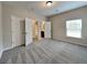 Spacious bedroom boasts two closets and an ensuite bathroom with a view at 305 Mango Ct, Mcdonough, GA 30253