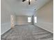 Expansive bedroom offers abundant space, a ceiling fan, and a neutral color palette at 305 Mango Ct, Mcdonough, GA 30253