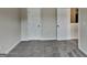 Neutral bedroom featuring plush carpeting and two white doors for ample closet space at 305 Mango Ct, Mcdonough, GA 30253