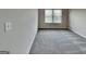 Carpeted room featuring neutral walls and base molding at 305 Mango Ct, Mcdonough, GA 30253