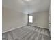Bedroom featuring neutral color scheme, large window, and ample space at 305 Mango Ct, Mcdonough, GA 30253