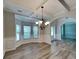 Elegant dining room featuring coffered ceilings, chair rail, and a large bay window at 305 Mango Ct, Mcdonough, GA 30253