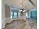 Elegant dining room showcasing coffered ceilings, wainscoting, and modern light fixture at 305 Mango Ct, Mcdonough, GA 30253