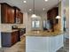 Modern kitchen featuring stainless steel appliances, granite countertops, and an island at 305 Mango Ct, Mcdonough, GA 30253