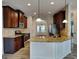 Charming kitchen with stainless steel appliances, island, and granite countertops at 305 Mango Ct, Mcdonough, GA 30253