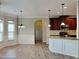 Bright kitchen with pendant lighting overlooking the breakfast nook, promoting open floorplan at 305 Mango Ct, Mcdonough, GA 30253