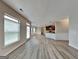 Spacious open-concept living area featuring lots of natural light and hardwood style floors at 305 Mango Ct, Mcdonough, GA 30253