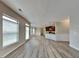 Spacious living room with luxury vinyl plank floors and lots of natural light at 305 Mango Ct, Mcdonough, GA 30253