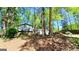 Attractive house surrounded by mature trees and lush landscaping at 644 Garden Grove Dr, Lawrenceville, GA 30044