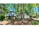 Charming home nestled among mature trees on a shaded lot at 644 Garden Grove Dr, Lawrenceville, GA 30044