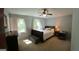Cozy bedroom with ceiling fan and comfortable decor at 644 Garden Grove Dr, Lawrenceville, GA 30044