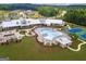 View of community pool, clubhouse, tennis courts, and surrounding greenspace at 444 Silverbell Ct, Peachtree City, GA 30269
