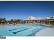 Community pool featuring large pool and ample lounge seating under a bright blue sky at 444 Silverbell Ct, Peachtree City, GA 30269