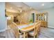 Dining area with wood floors and open access to the kitchen and living room at 444 Silverbell Ct, Peachtree City, GA 30269
