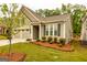 Attractive home showcasing a manicured lawn, mature trees, and a convenient two-car garage at 444 Silverbell Ct, Peachtree City, GA 30269