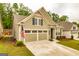 Beautiful craftsman-style home with a two-car garage, well-maintained lawn, and inviting curb appeal at 444 Silverbell Ct, Peachtree City, GA 30269